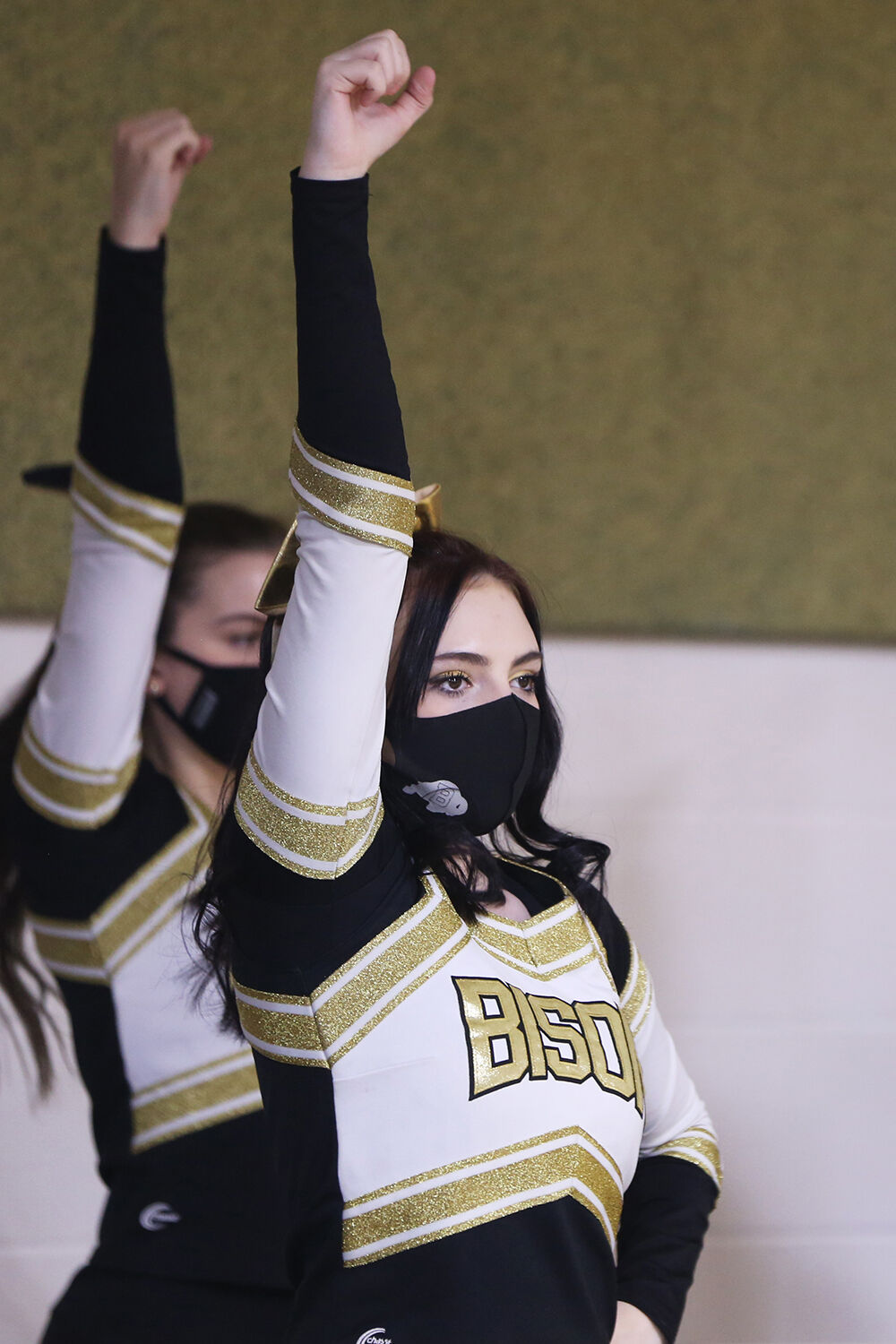 Cadance Foust straightens one arm above her head